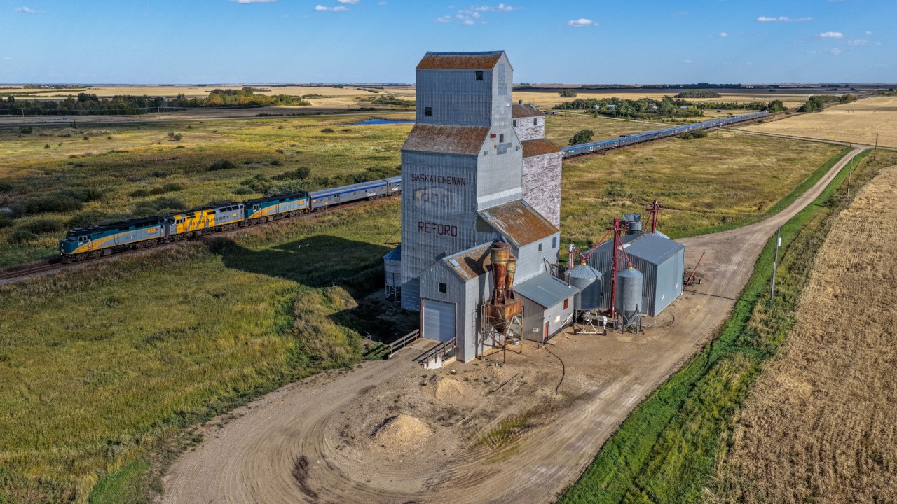 The westbound Canadian cruises past the elevator at Reford with VIA 6434, VIA 6420 and VIA 6441.