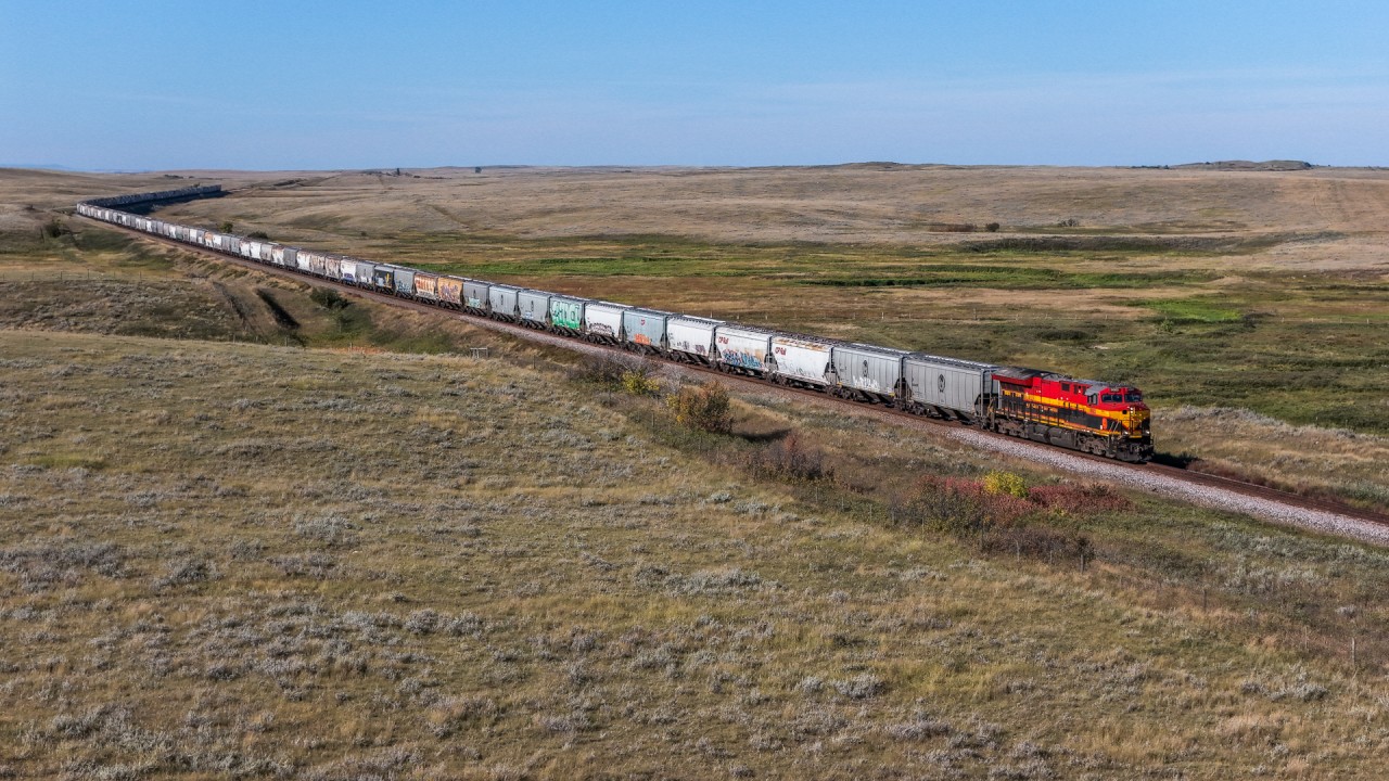 KCS 5002 east approaches Piapot with empty grain train 318-598.  Piapot, is named after the Plains Cree Chief Piapot, who led a blockade of the CPR right of way near Moose Jaw, during railway construction in 1882 and 1883.  The North West Mounted Police were dispatched to remove the blockade and negotiated a peaceful resolution with Chief Piapot to allow construction to resume across the prairies.  He was also known for advocating for indigenous rights and negotiating better terms for his people under Treaty 4.