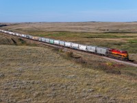 KCS 5002 east approaches Piapot with empty grain train 318-598.  Piapot, is named after the Plains Cree Chief Piapot, who led a blockade of the CPR right of way near Moose Jaw, during railway construction in 1882 and 1883.  The North West Mounted Police were dispatched to remove the blockade and negotiated a peaceful resolution with Chief Piapot to allow construction to resume across the prairies.  He was also known for advocating for indigenous rights and negotiating better terms for his people under Treaty 4. 