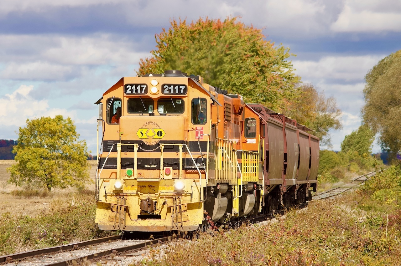 It’s probably been about a decade since I last followed the original Goderich Exeter. Back then business on the line was still pretty steady, typically at least 5 days a week. Back then the line to Hensall and beyond was still on shaky ground but at least served regularly. Today things are different on the GEXR the line to Goderich see service once or twice a week while Hensall sees very limited service. This day I originally hoped to do the run to Goderich and back for old time sake but am thankful they took the more rare trip to Hensall. From what I hear the line is no longer served in the winter months due to heavy snow and bad track conditions. This day PRSL cab GP38 2117 is seen making the 10mph trip towards Hensall with four BNSF hoppers in tow. The train will return north a few hours later with the same number of cars. The train is seen passing farmland and grinding rust off the rails near Brucefield.
