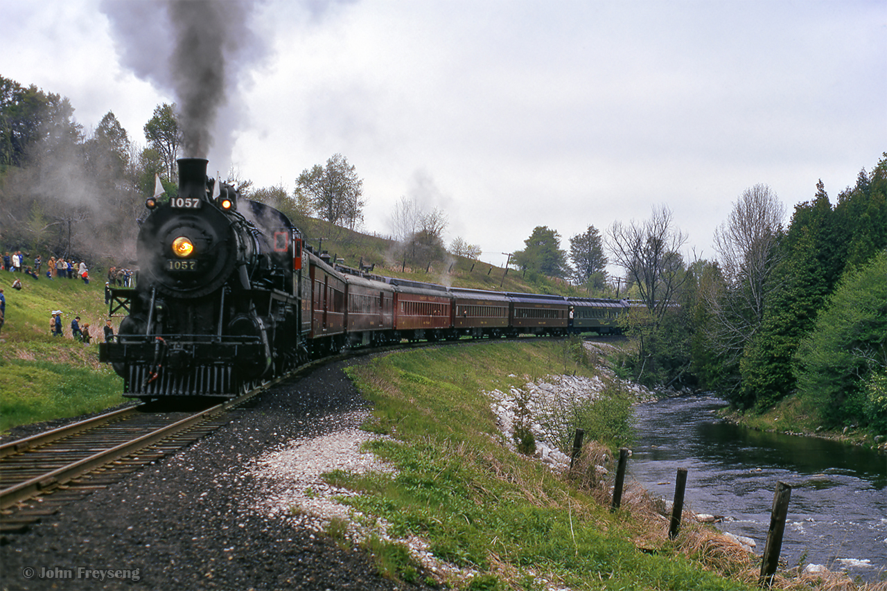 Ontario Rail Association's ex CPR D10 1057 is shown at Cataract, a bit north of the junction switch with the Elora Sub, as fans disembark for a runpast along the Credit River.

Pausing in Mississauga
Mississauga runpast

Scan and editing by Jacob Patterson.