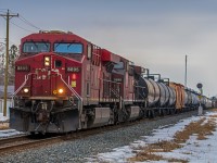 One of CPKC's mixed freight trains heading South through Winnipeg's St. Boniface neighborhood on the way to the United States.