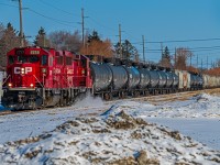 A small mixed train heading through the River Heights neighborhood on the way to the South end of the city.