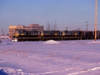 On January 1, 1981 Canadian National assumed sole ownership of the Northern Alberta Railways which previously had been jointly owned with Canadian Pacific. This slide, processed in January 1981, shows GP9s 206, 211, and 205 ready to head north from Dunvegan yard. These units would be renumbered into CN's 4600 series later in 1981.