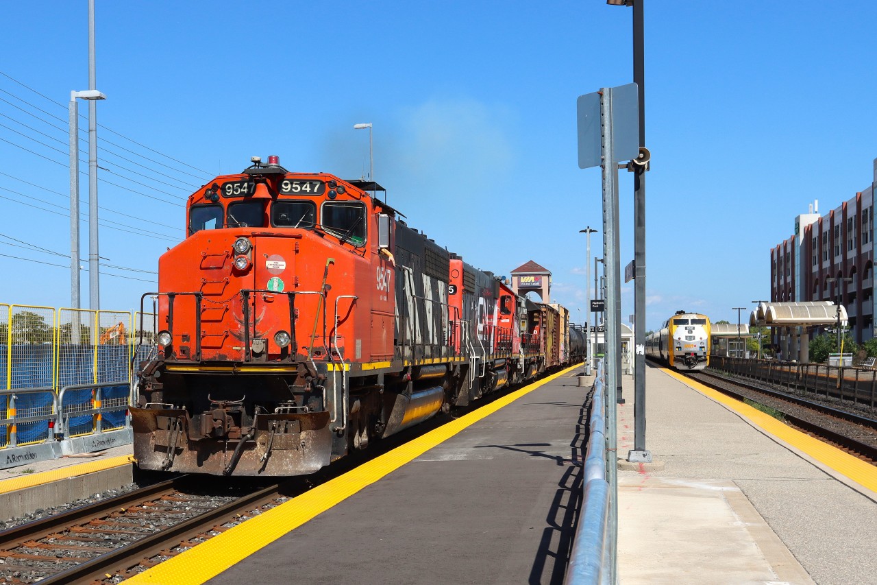 With the tail end clear of Oakville Yard, L554 CN 9547 IC 9615 CN 4716 throttles up as VIA 72 makes the station stop on T2. Oakville GO Station is in the beginning stages of improvements and enhancements which includes platform work and a new pedestrian bridge.