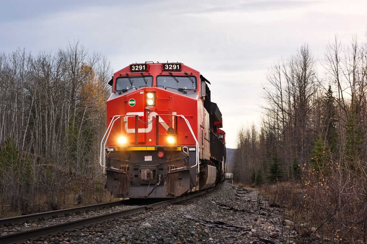CN 3291, one of the newest ET44AC locomotives on the CN roster pulls a heavy frac sand train up to Fort St John.