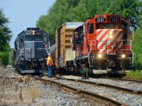 Two GP9's from different operators meet in St. Thomas Ontario as the St. Thomas turn's of both OSR and GIO help each other as they both try to leave town. Both trains would follow each other from St. Thomas yard, OSR would take the switch first and GIO would assist with throwing switches to help the OSR get out of town faster.

