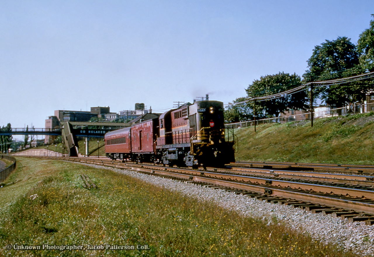 Daily except Sunday CPR train 326, running from Hamilton - Toronto, passes through Sunnyside.

Original Photographer Unknown, Jacob Patterson Collection Slide.