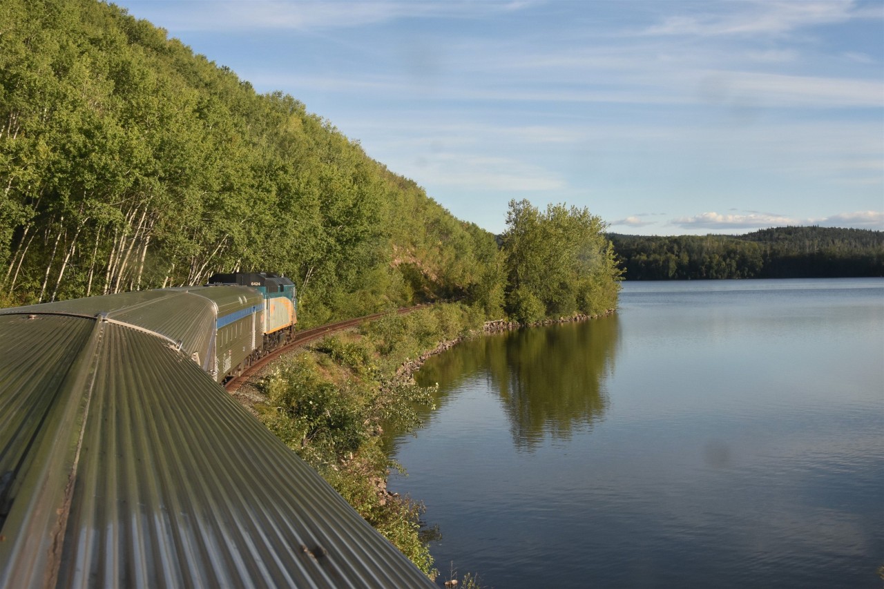 The Skeena at Burns Lake  
VIA 6424 leads VIA 006 The Skeena eastbound out of the town of Burns Lake and skirts the shore of the namesake Lake.