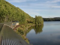 <b> The Skeena at Burns Lake </b> <br>
VIA 6424 leads VIA 006 The Skeena eastbound out of the town of Burns Lake and skirts the shore of the namesake Lake.