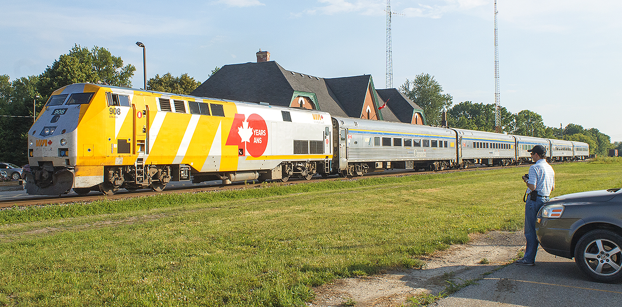 Still wearing the 40th Anniversary wrap, VIA 908 sits as train 78 makes its station stop. Always nice to see another railfan. Although, I'll miss seeing and hearing the sound of those stainless steel cars.


NOTE: off in the distance (to the right of the last car) was a classic CN boxcar. It sat on one of the many sidings, that were in place to serve many industries of 'yester-year'. CN had used it for storage, complete with a small deck with stairs. I had always planned to incorporate it into one of my photos, but sadly it was dismantled a few years ago. The area where all spare supplies (crossing lights, old gates etc.) was also fenced off then too.