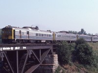 VIA train 637, with four rail diesel cars, races westward over the Credit River in Port Credit on Saturday July 19, 1980 on their way to Niagara Falls.
