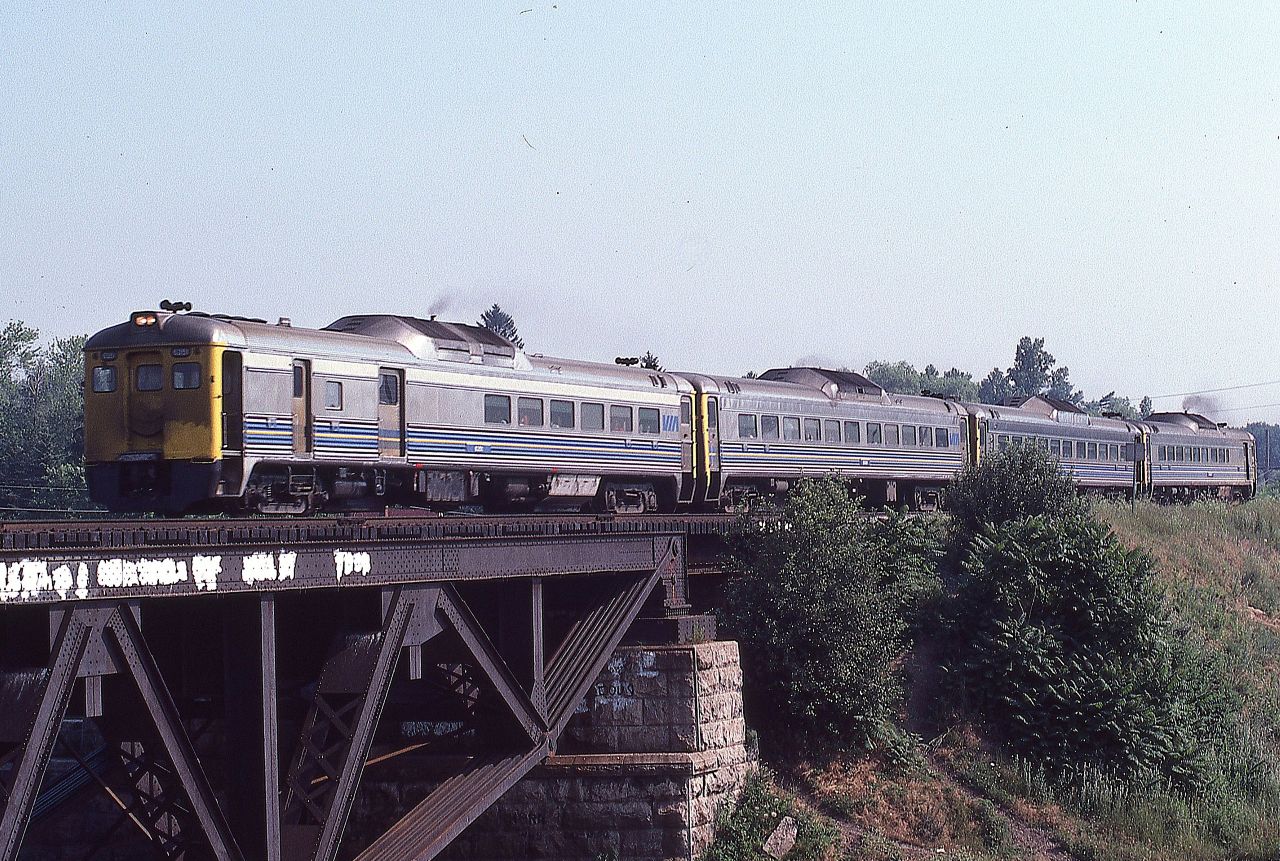 VIA train 637, with four rail diesel cars, races westward over the Credit River in Port Credit on Saturday July 19, 1980 on their way to Niagara Falls.