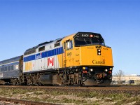 VIA F40PH-2 #6401 flies through Appleby GO station in Burlington, with the morning train from London to Toronto (I forget the train number). The widened blue stripe and added Canada heralds were still relatively new at the time. Also of note is the unique VIA Rail Canada logo on the car behind the locomotive- this style on a white background was only applied to HEP-2 car 4113. 