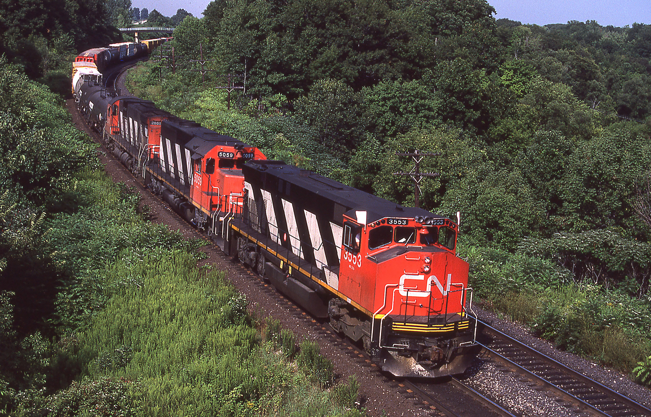Westbound CN 3553 (MLW M420W) heads towards Bayview Junction, Ontario on 08/10/1987.