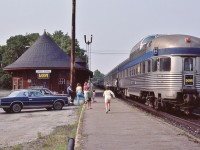<br>
<br>
On the move …. CP Rail Parry Sound Operator holds steady to deliver #9's train orders to the Conductor.
<br>
<br>
At CP Rail Parry Sound, July 13, 1985 Kodachrome by S.Danko 
<br>
<br>