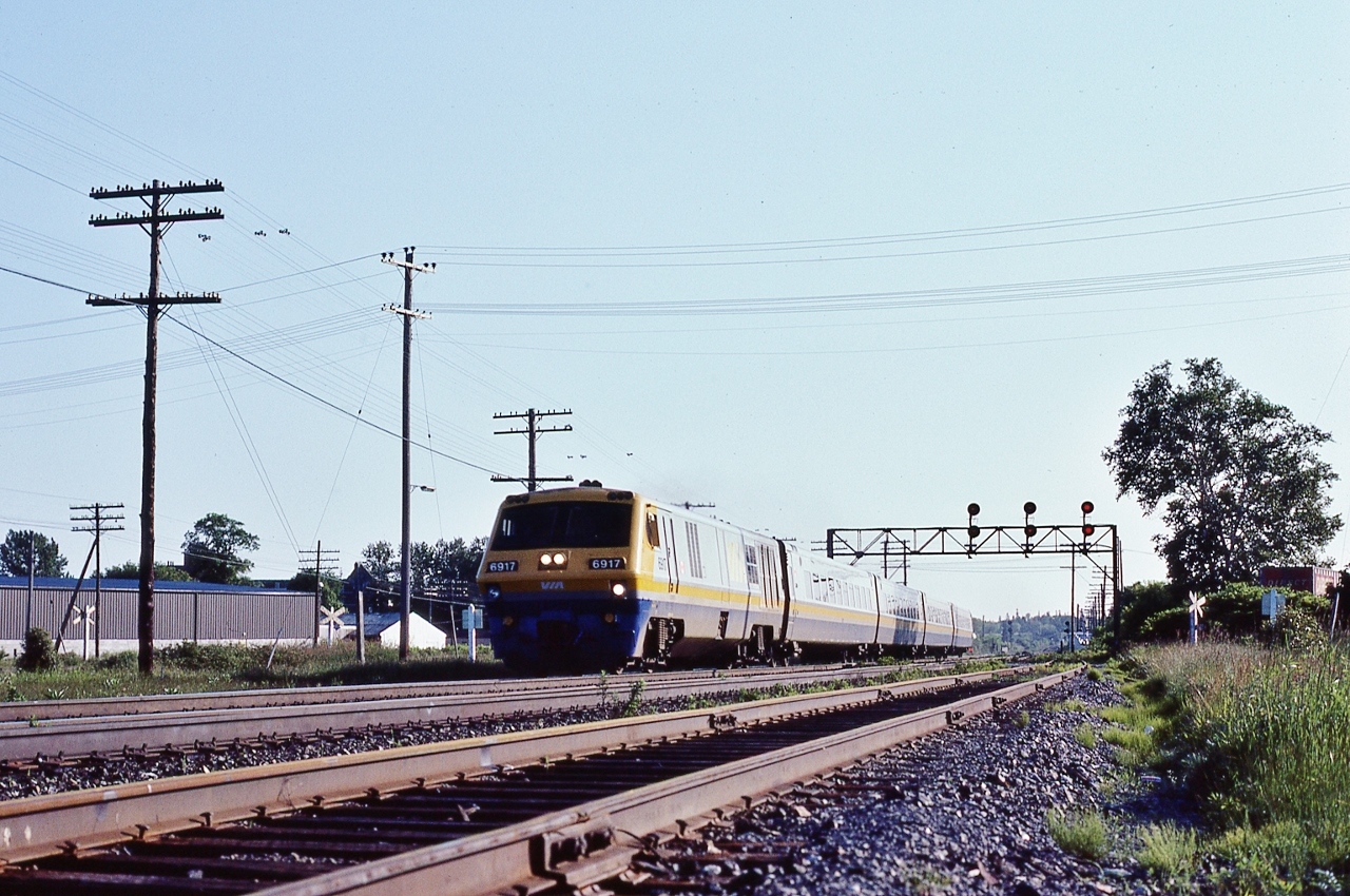 L – R – C 


Lighweight – Rapid – Comfortable


The Promises  


Then Reality 


Well, it was nice for a while, VIA 6917 East at Cobourg, June 26, 1982 Kodachrome by S.Danko


That overhead  hydroline topping the CN telegraph / power line denotes the circa 1853 right of way for the Cobourg and Peterborough Railway – predating the GTR by several years and the CPR by 58 years! 


To the left of 6917 are the crossbucks for the CPR George Street level crossing. 


Immediate foreground is the north service track providing access to the Wye and to the CNoR trackage. A short distance to the north a section of the former CNoR mainline remains in place (in 2026) – to service the local industrial area. The CNoR mainline right-of-way remains clearly visible and  sections of Kerr Street / McArthur Street are located on the located on the CNoR.


sdfourty